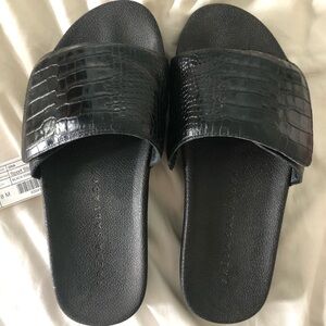Gently used Freda size 8 black oni snake skin pattern slides
